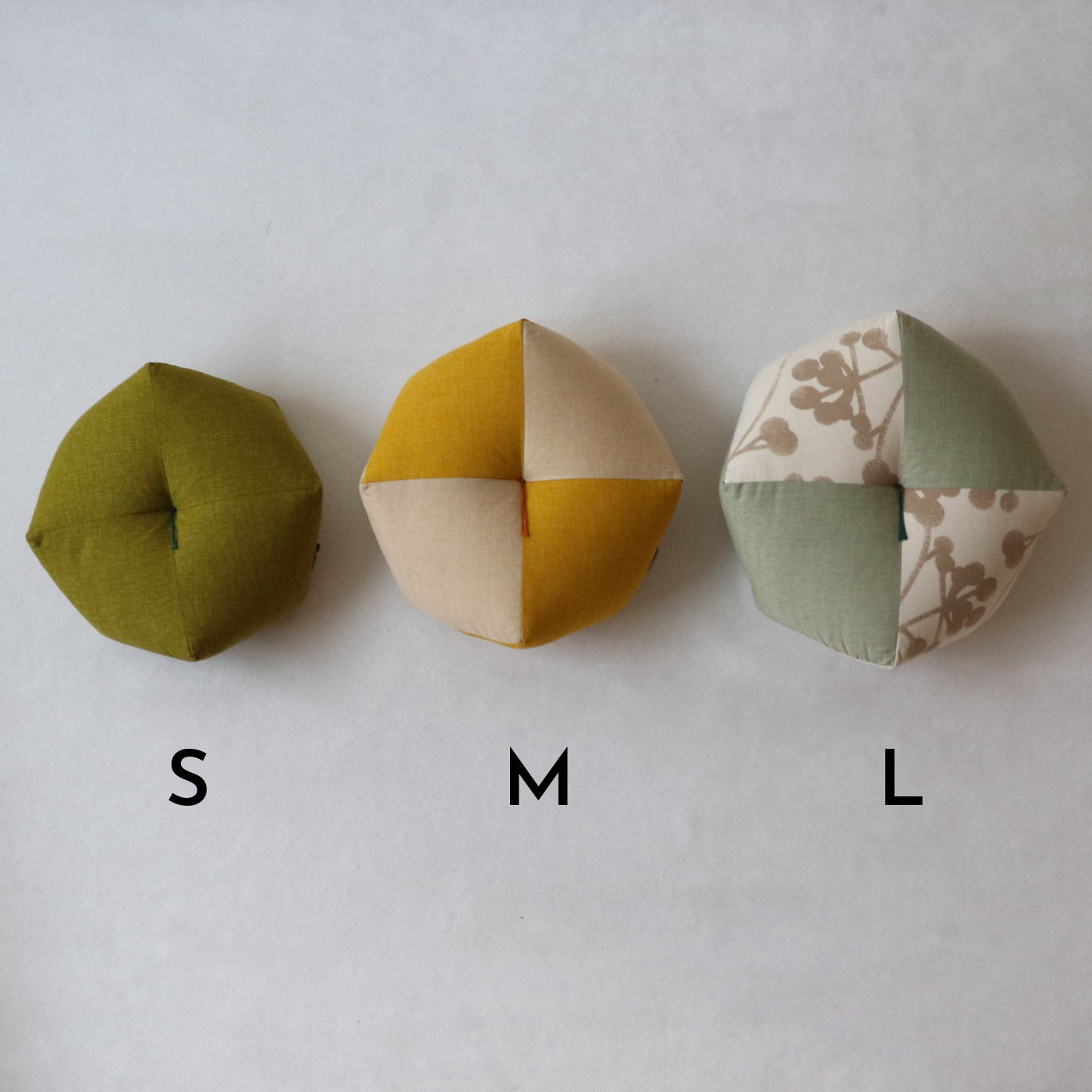 The Ojami cushion is an original cushion developed by Takaokaya over the last decade. The unique shape is inspired by the ancient Japanese beanbag toy called otedama, or ojami in the Kyoto dialect. Handcrafted by our skilled Kyoto craftsman, Ojami cushions come in a variety of colors, fabrics, and sizes to suit your preference and lifestyle.