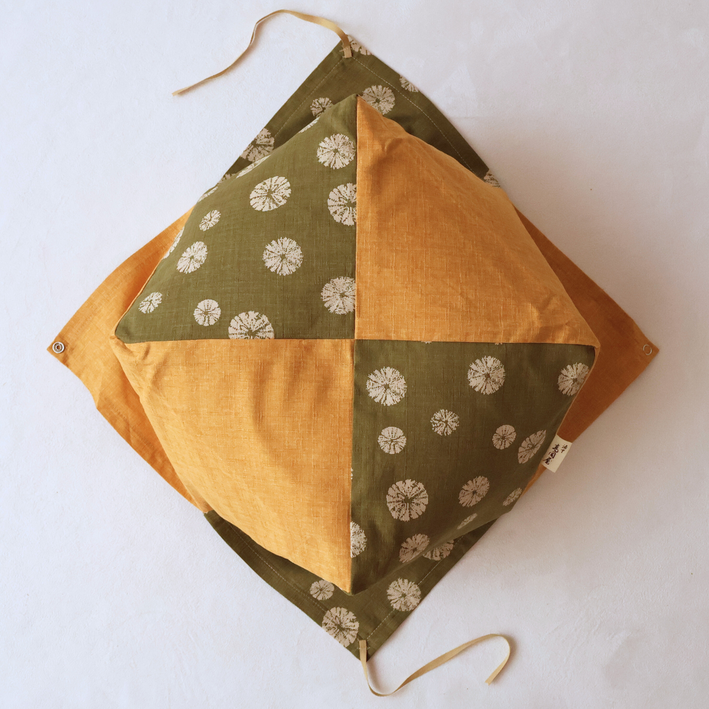 STEP 1: Align the four corners of the cover with the cushion and slip it over the top