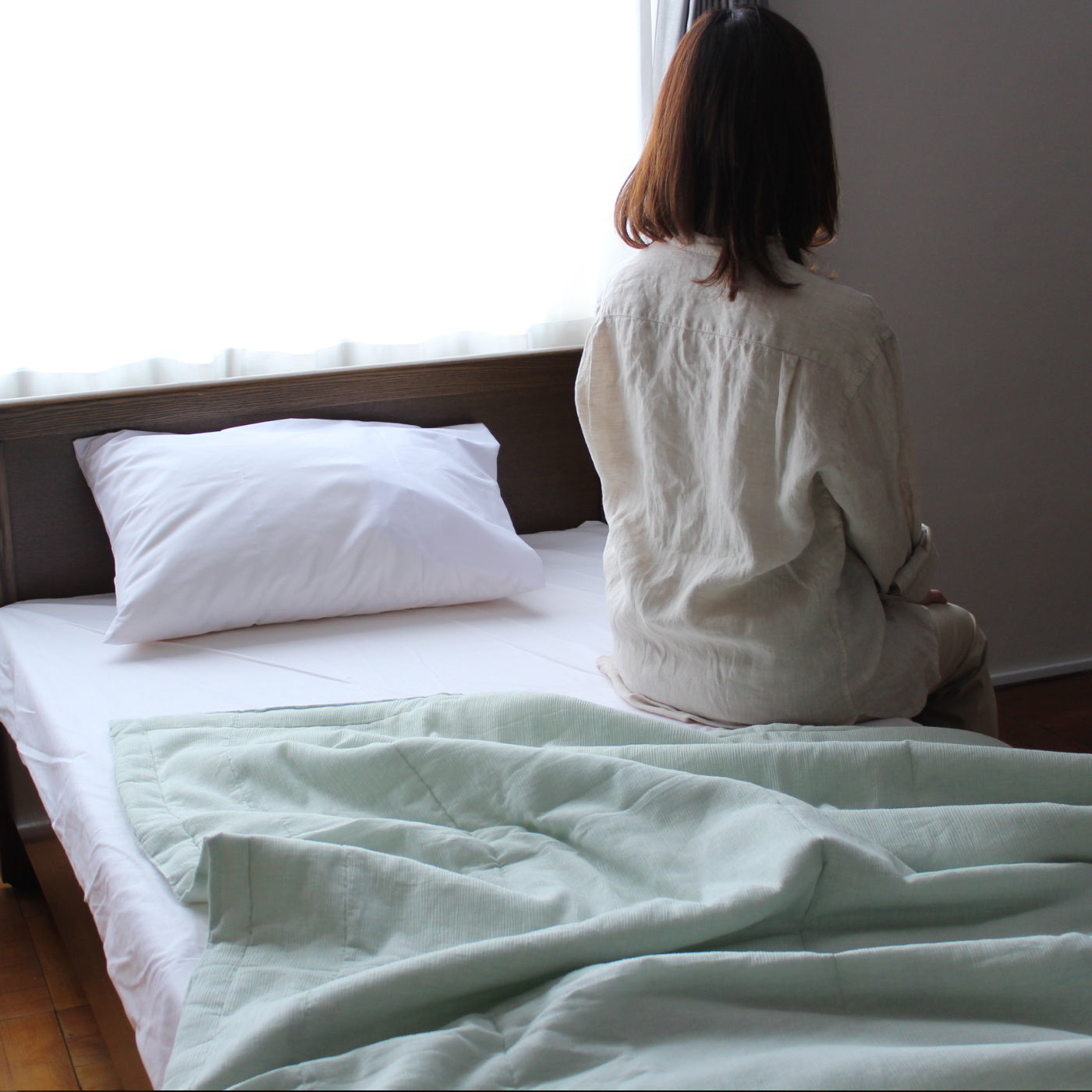 To sleep comfortably during this hot summer, we Japanese think to make our futon smaller (120 x 160 cm) than the regular size. Due to its size, we can put our arms and legs out from the futon to keep our body cooler, but not make our belly cooler by covering it with a futon. 